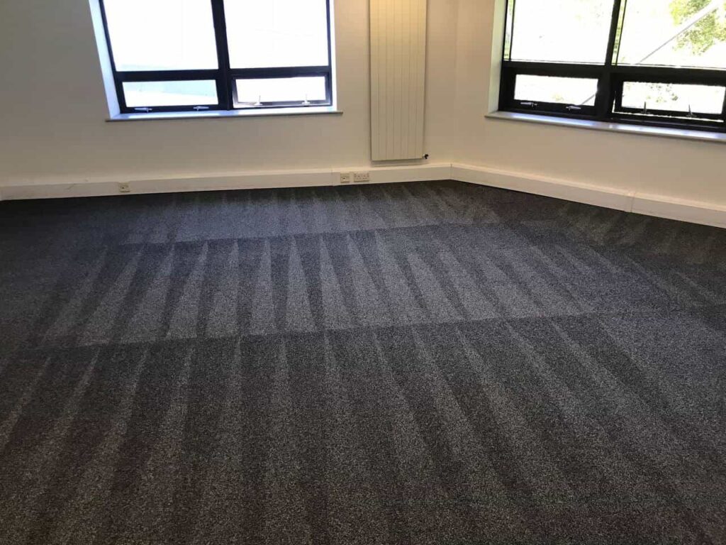 This is a photo of a grey office carpet that has just been professionally steam cleaned.